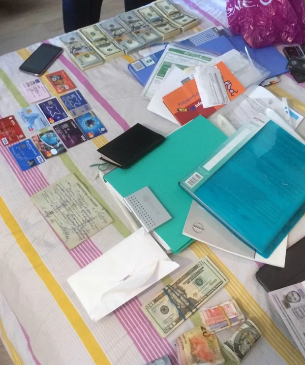 The seized cash, credit cards, IDs, financial documentation and more